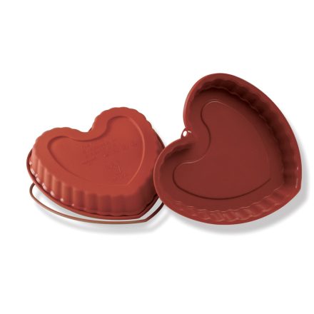 Egy üres, piros színű, szív alakú szilikon tortaforma, mellette a Safe Ring merevítő gyűrű.